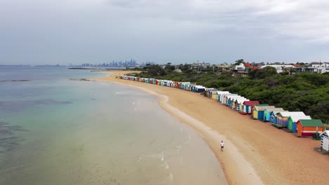 Drone-Aeriel-Footage-at-Brighton-Beach-Over-Colourful-Beach-Houses---82-distinctive-Bathing-Boxes-Port-Phillip-Bay-Melbourne-Victoria-Australia