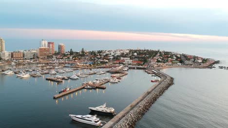 Drone-shot-of-Yachts-and-hotels-in-Punta-del-Este-during-the-sunset