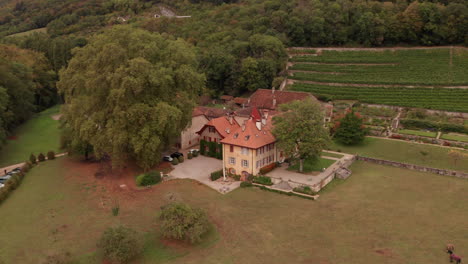 Aerial-dolly-of-beautiful-old-building-in-Swiss-countryside
