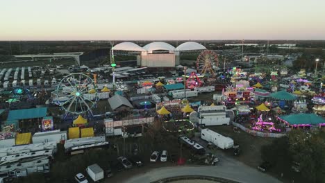 Aerial-View-of-Florida-State-Fair-With-Amphitheatre-and-I-4-in-Background-During-Sunset-Tracking-Forward