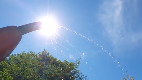 Water-park-splash-pad-jet-spraying-water-on-hot-summer-day