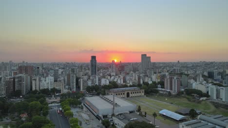 Aerial-descending-view-overlooking-Palermo-district-Buenos-Aires-urban-city-landscape-at-sunset