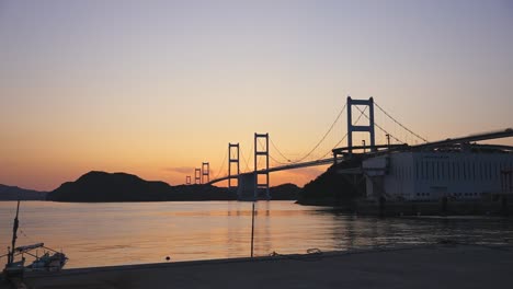 Shimanami-Kaido,-Sunset-over-the-Kurushima-Kaikyo-suspension-Bridge