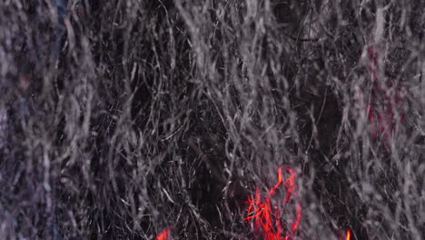 Extreme-Close-Up-Of-Steel-Wool-With-Glowing-Fire-Moving-Behind