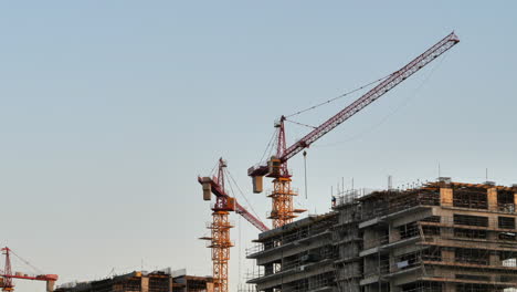 Static-shot-of-cranes-working-on-building-construction