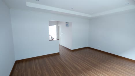 Empty-White-Room-With-Wooden-Floor