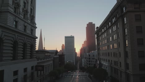 Rising-aerial-shot-of-a-city-at-dawn-or-dusk
