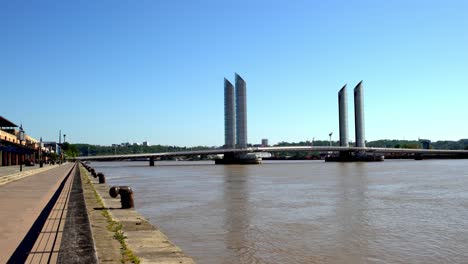 Jacques-Chaban-Delmas-Bridge-in-Bordeaux-France-with-low-traffic-because-of-the-COVID-19-pandemic,-Side-view-shot