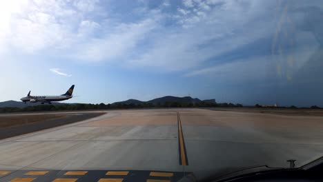 Pov-shot-from-airplane,pilot-waiting-for-clearance-during-Ryanair-Aircraft-landing-at-landing-strip