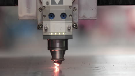 Tip-Of-Laser-Cutting-Machine-Working-With-Sparks---Modern-Equipment-For-Metalwork
