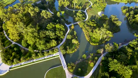 Green-Park-with-Beautiful-Landscaping-Paths---Ponds---Aerial-Drone-Overhead