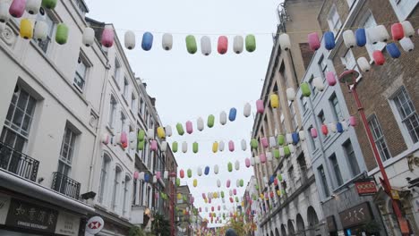 Colourful-lanterns-hanging-over-London-Chinatown-on-a-grey-rainy-day