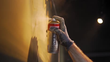 Slow-motion:-Man-is-drawing-and-painting-with-spray-paint-and-having-fun