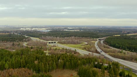 Time-lapse-of-a-highway---Speed-up-aerial-shot-from-a-motorway-curved-exit-in-southern-germany---fast-driving-cars-in-4k