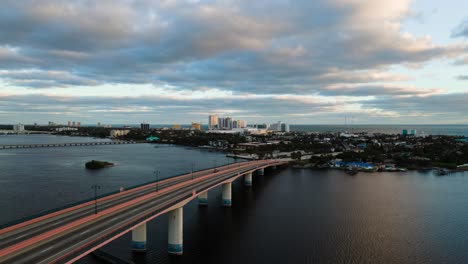Amazing-aerial-time-lapse-of-cars-driving-through-a-bridge-at-the-Halifax-River-in-Daytona-Beach,-Florida