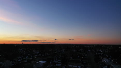 An-aerial-shot-over-a-suburban-neighborhood-at-sunrise
