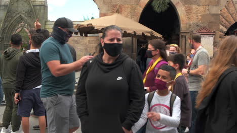 People-wearing-masks-walking-through-Universal-Studios-during-the-COVID-19-Pandemic