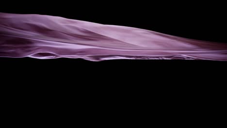 Smooth-pink-silk-flying-in-black-background