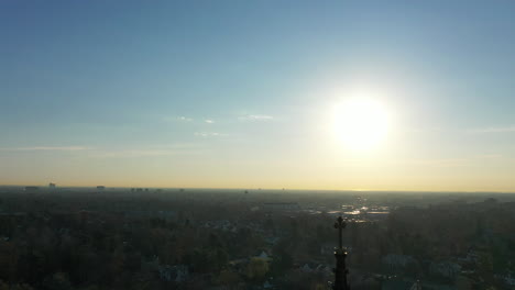 An-aerial-shot-of-a-cathedral's-steeple,-which-was-taken-at-sunrise