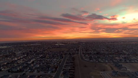 A-drone-flies-backward-revealing-an-epic-sunrise-over-Northern-Colorado