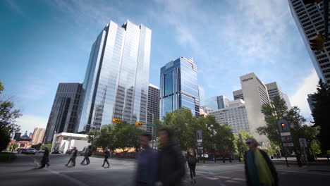 Cinematic-time-lapse-of-a-downtown-intersection-with-towering-skyscrapers