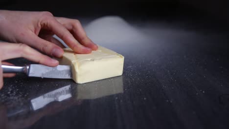 Chief-cutting-slices-of-butter