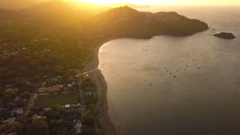 Drone-flying-over-a-beautiful-tropical-shoreline-at-dawn