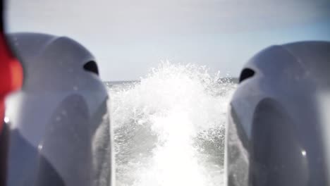 Boat-cruising-in-the-ocean-with-water-closeup-splashing-in-slow-motion