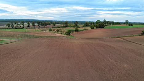 Aerial-view-of-polish-countryside-meadow-shot-in-Kaszuby,-pomorskie-in-Poland