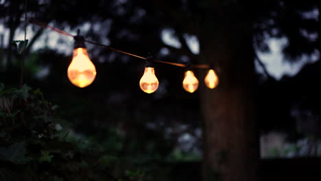 A-string-of-garden-lamps-is-moving-with-the-wind