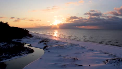 Colorful-Winter-Sunset-on-the-Shore-of-the-Gulf-of-Riga-in-Latvia-Saulkrasti-White-Dune