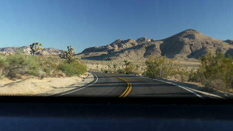 Driving-during-sunset-at-the-Joshua-Tree-national-park-desert
