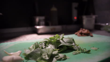 Footage-Of-ingredients-On-A-Green-Cutting-Board-SLIDE-SHOT