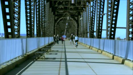 A-walking-bridge-with-people-and-a-bicyclist