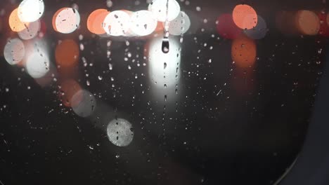 Rain-at-night-on-an-airplane-window