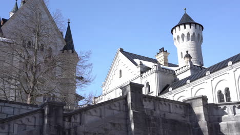 Panoramic-of-Neuschwanstein-castle-from-inside-its-courtyard-4k-footage
