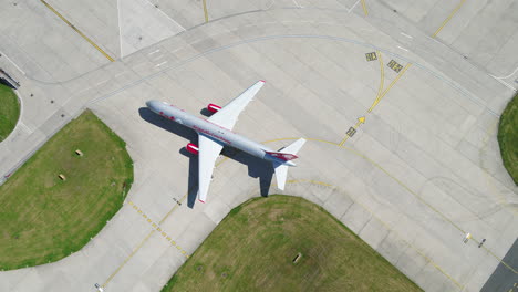 Aerial-footage-of-a-Jet2-aircraft-arriving-and-taxiing-onto-its-arrivals-gate