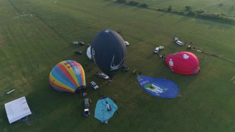 First-balloons-being-to-rise,-aerial-point-of-view