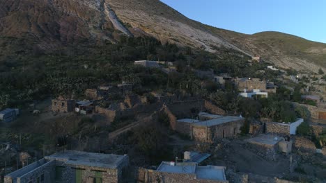 Aerial-shot-of-buildings-and-ruins-in-Real-de-Catorce-at-sunset,-San-Luis-Potosi-Mexico