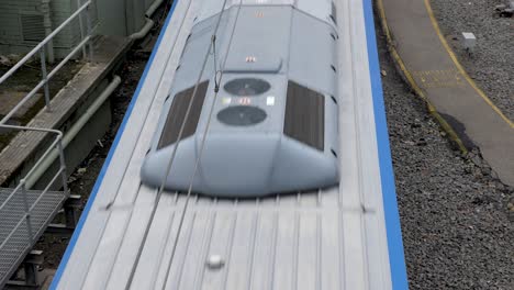 melbourne-PTv-train-passing-under-bridge,-near-Federation-Square,-Melbourne-CBD-,July-2019