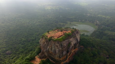 Distant-rotating-aerial-shot-of-Sigiriya-Rock,-Sri-Lanka