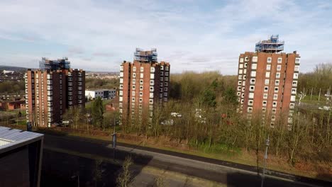 High-rise-tower-blocks,-flats-built-in-the-city-of-Stoke-on-Trent-to-accommodate-the-increasing-population,-housing-crisis-and-over-crowding,-immigration-housing
