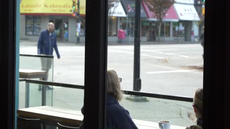 two-women-on-patio-enjoy-morning-coffee