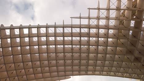 Looking-up-at-Las-Setas-wooden-structure-landmark-in-Seville,-Spain
