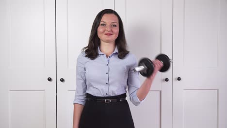 Business-girl-lifting-dumbbell-and-catching-leek,-symbolism-of-healthy-lifestyle