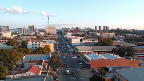 A-stationary-overhead-drone-shot-of-Bulawayo,-Zimbabwe's-city-area-at-sunset