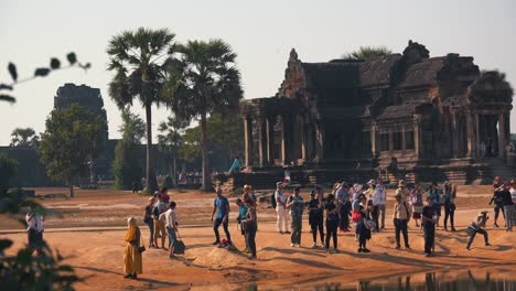 Wide-Shot-of-Tourists-Hanging-Out-Outside-of-Ancient-Temple