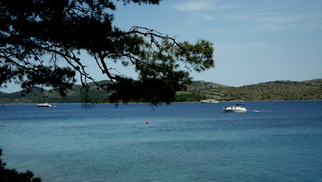 Many-yachts-are-standing-in-the-harbor-in-calm-blue-water-on-dugi-otok-island-in-croatia