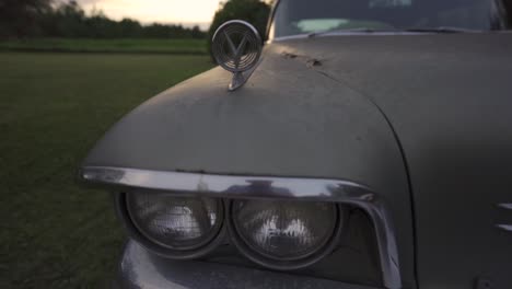 Headlights-Of-Vintage-Collectors-Buick-Car,-Outdoors-At-Sunset