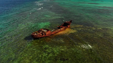 Epic-aerial-of-a-shipwreck-on-a-reef-located-in-the-Caribbean